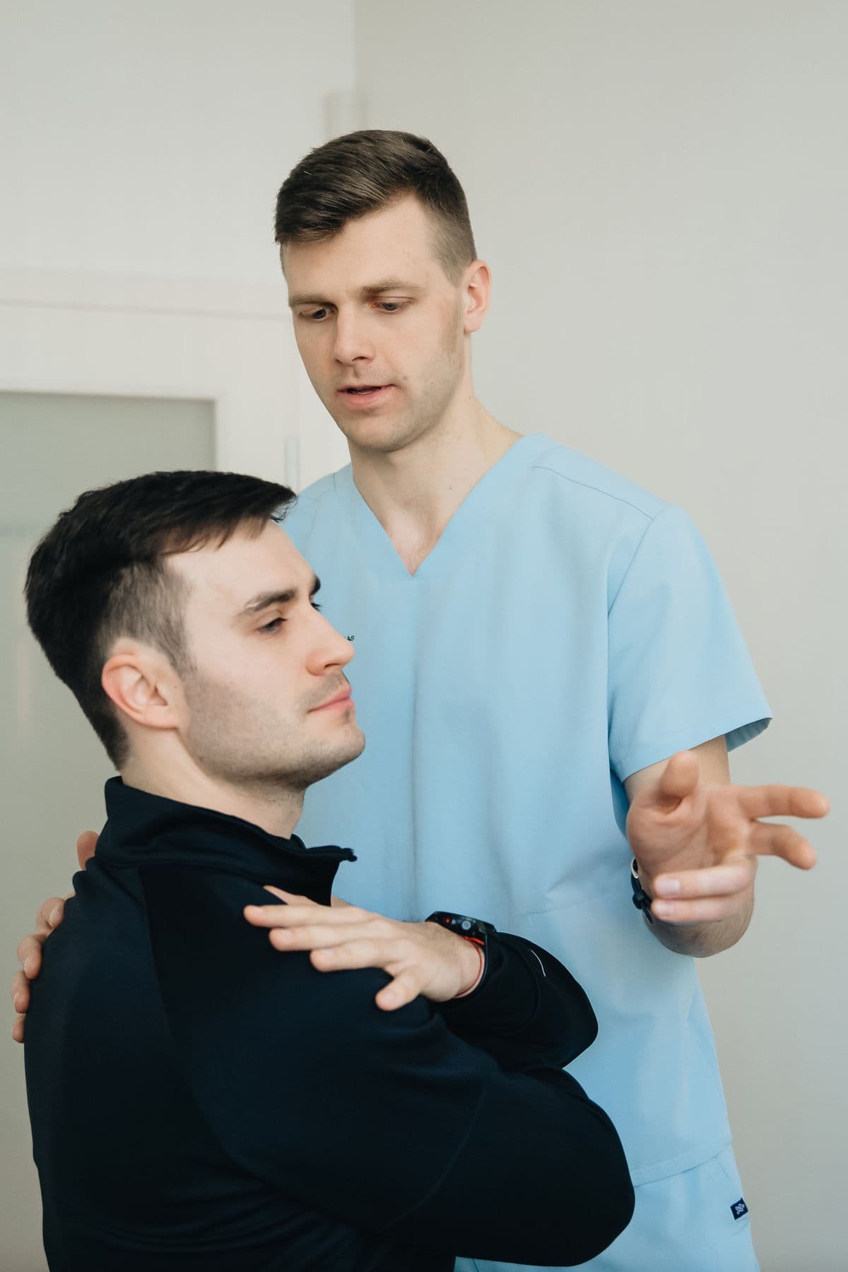Physiotherapist assessing a patient's neck posture